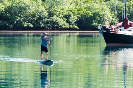 Serge paddling over, Joanne looking on